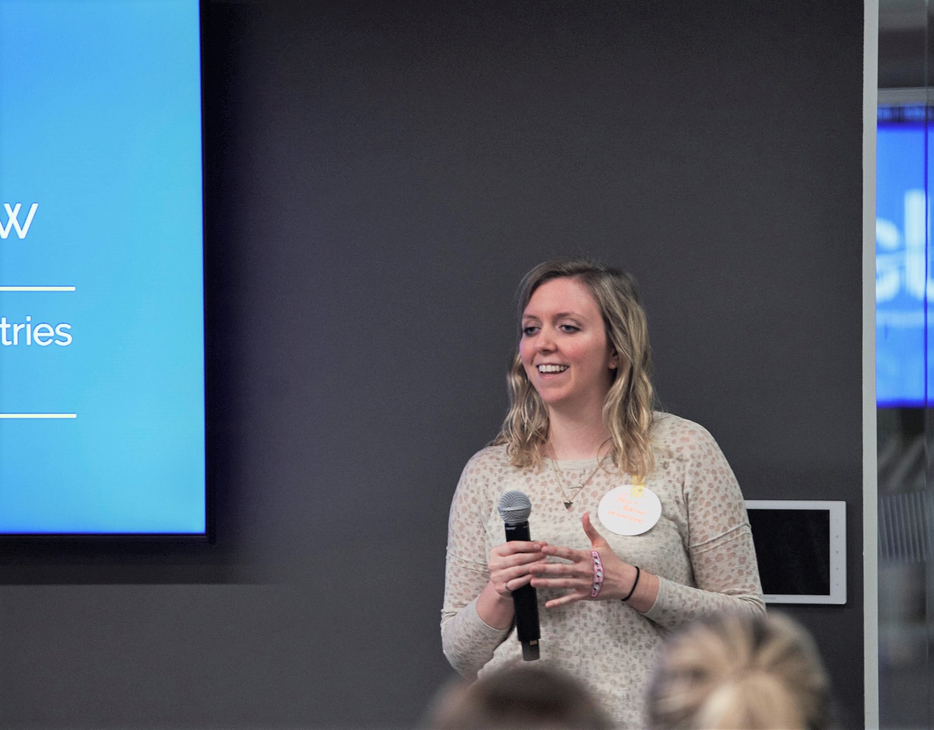 Holly Burton Leadership Coach for Women in Male-Dominated Industries speaks to women at her WIMDI meetup. Photo by Angela McConnell.