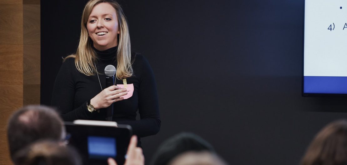 Audience member takes photo of Holly after talk on the opportunities in reducing bias in hiring