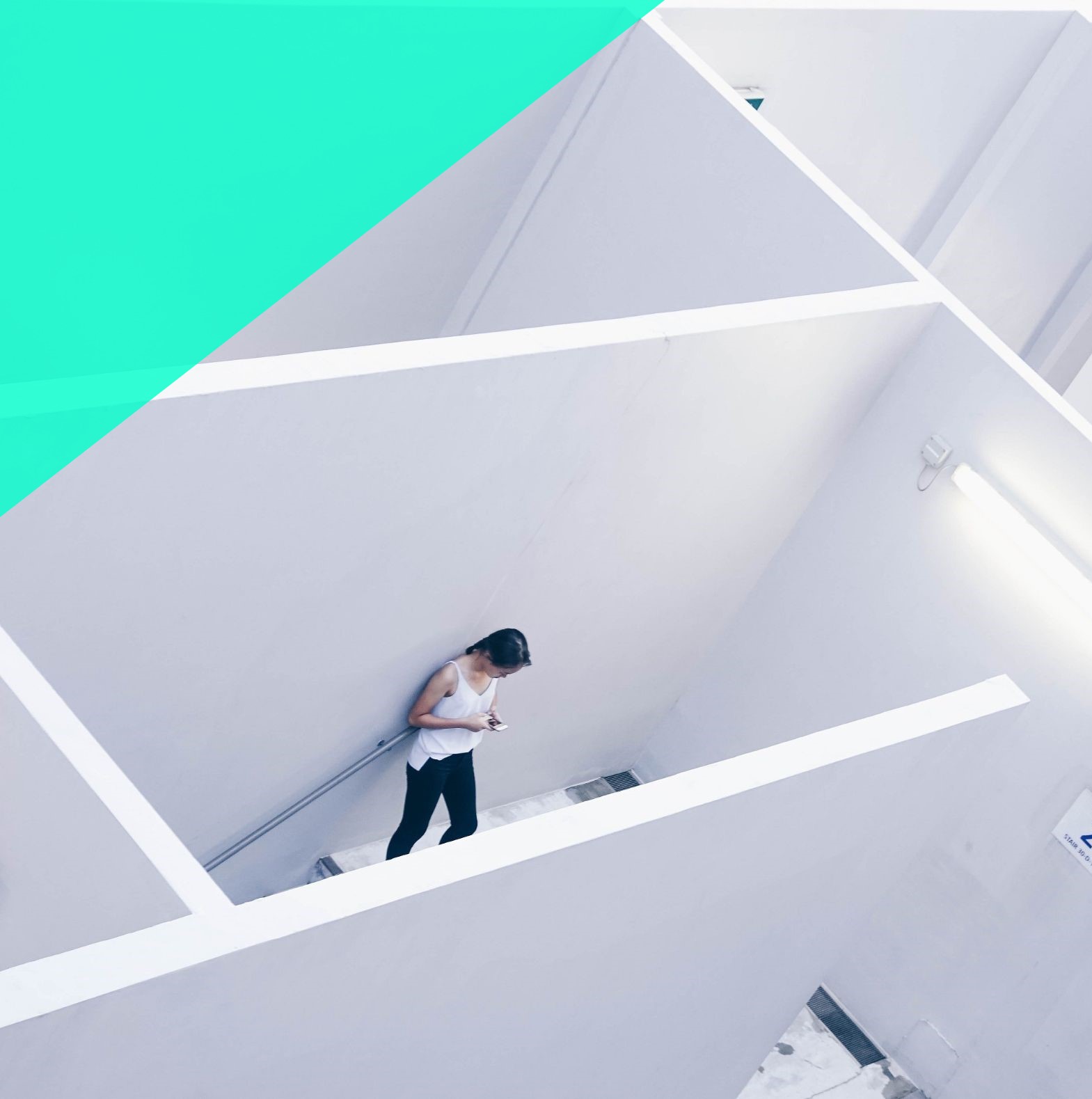 Woman stands alone staring at her phone | diversity consultant