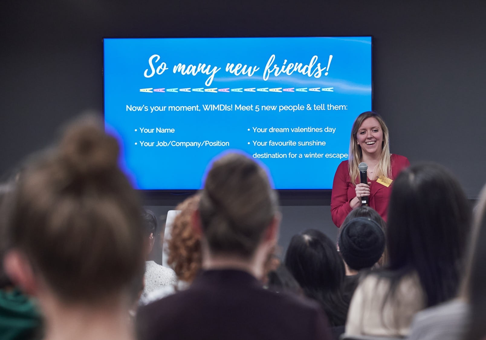 Holly smiles in front of group after talk on dealing with imposter syndrome |  by Vancouver photographer Angela McConnell