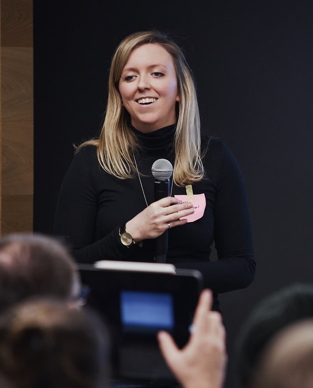 Audience member takes photo of Holly after talk on the opportunities of reducing bias in hiring | by Vancouver photographer Angela McConnell